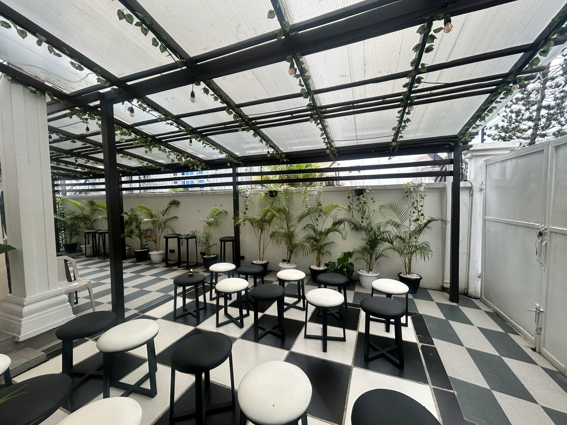 Covered courtyard and seating at ROJ in Ikota